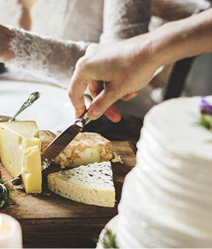 Bride and Groom Having Meal with Friends at Wedding Reception