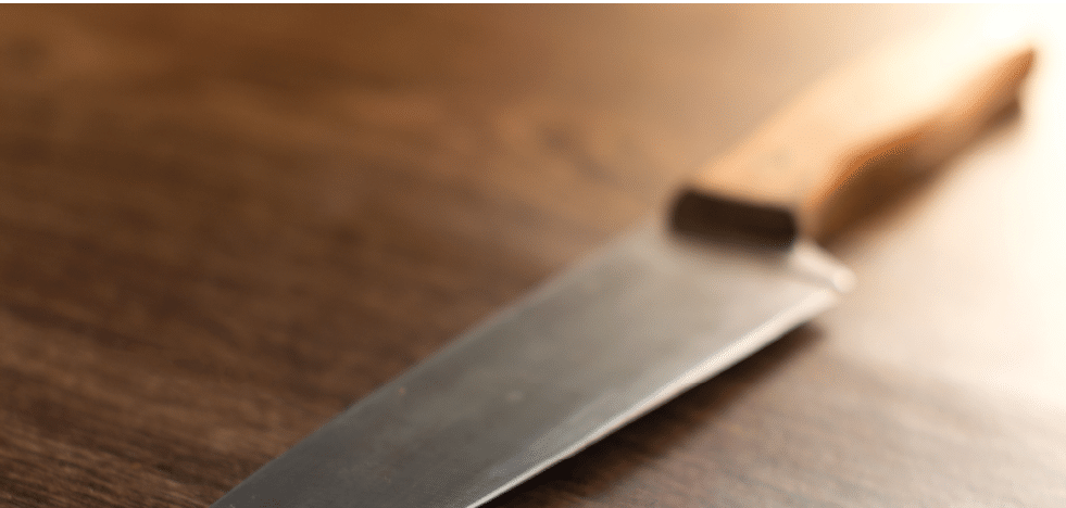 Kitchen knife on a wooden background