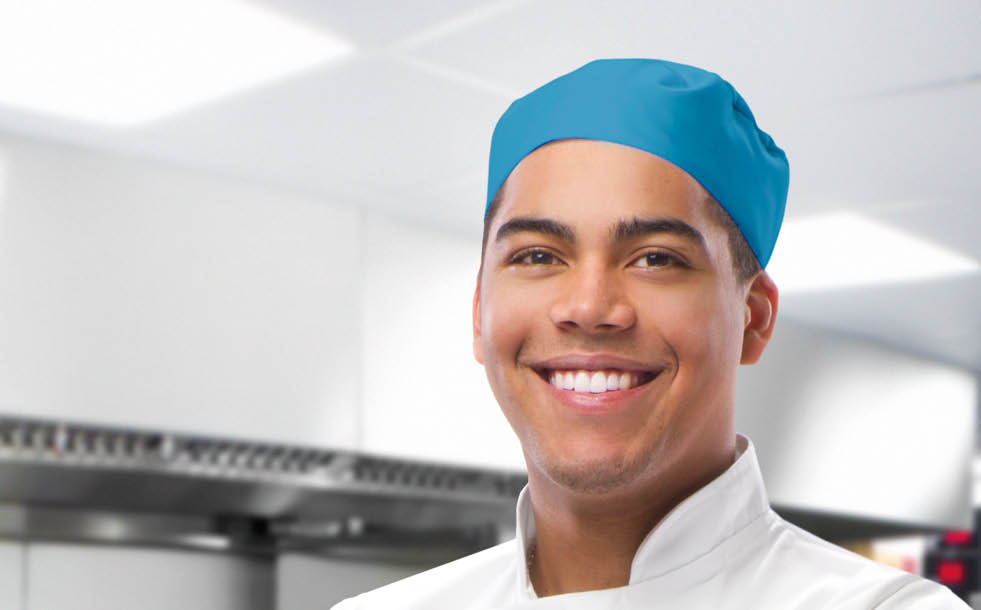 happy trainee chef in modern kitchen