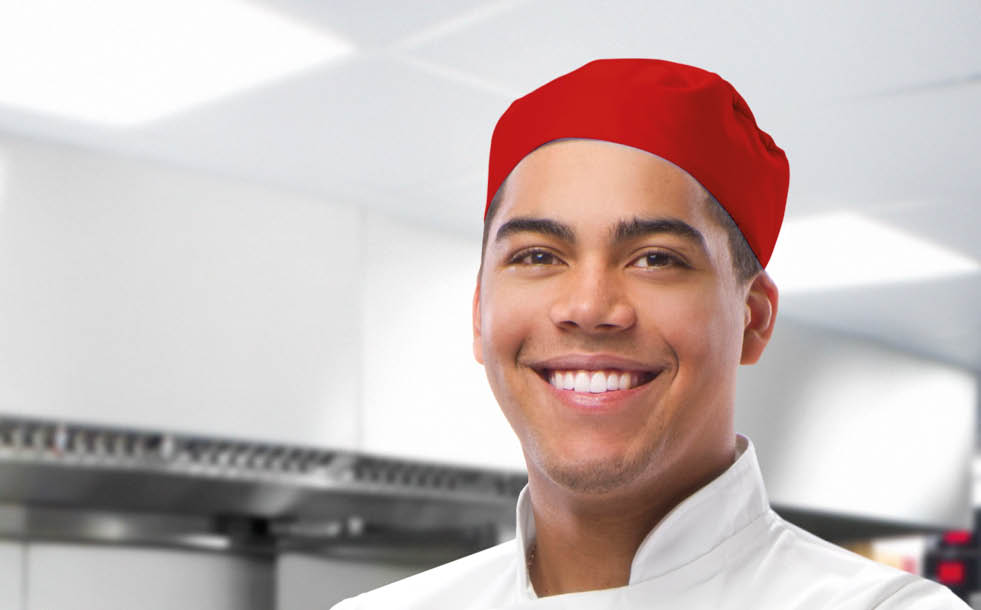 happy trainee chef in modern kitchen