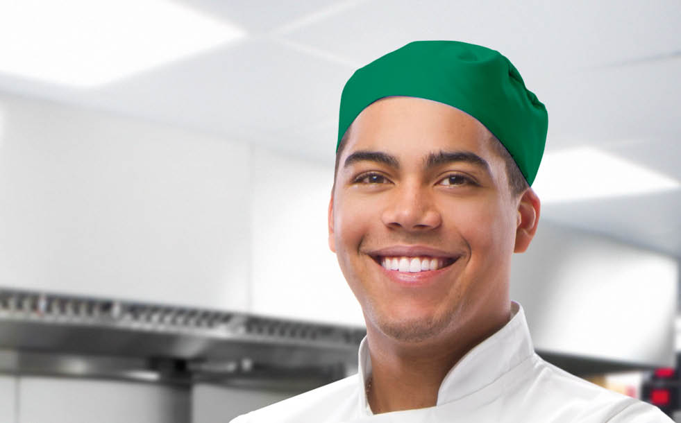 happy trainee chef in modern kitchen