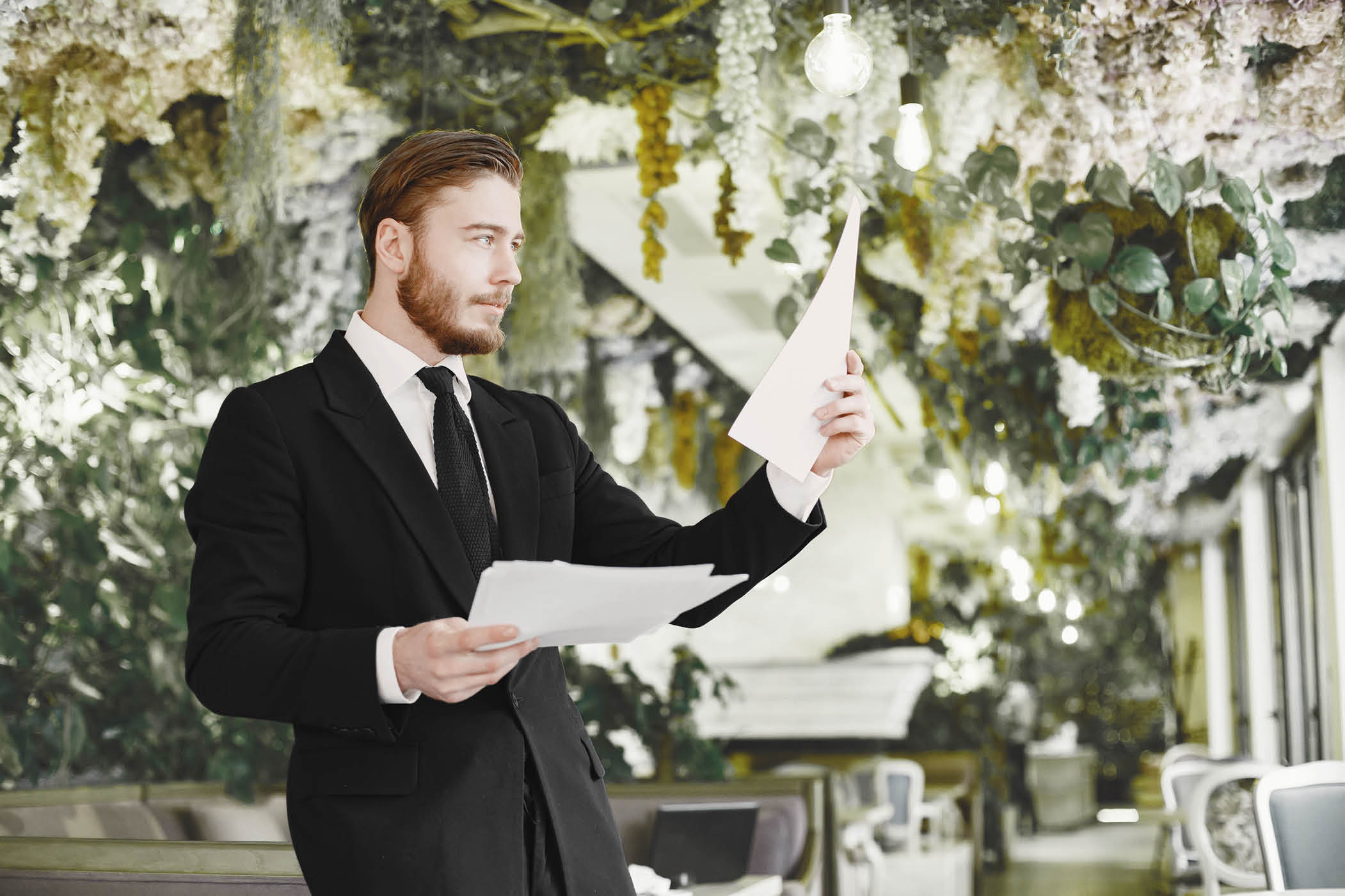 Man standing at the office with documents