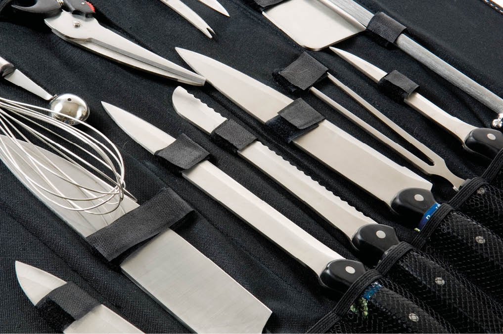 Professional chefs, cooks knife set in black case on white background
