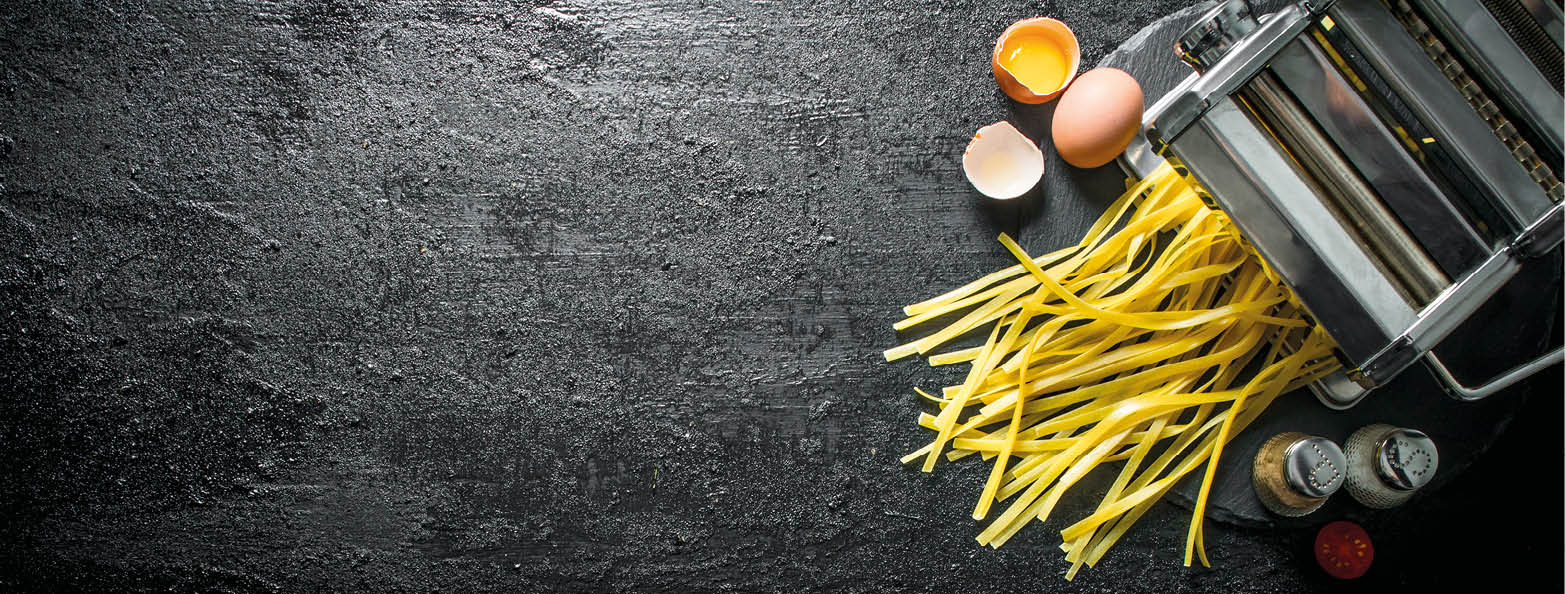 Cooking homemade pasta. On rustic background